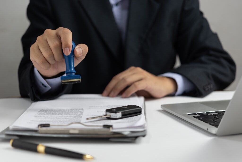 businessman signing a contract for buying of selling a car car rental service
