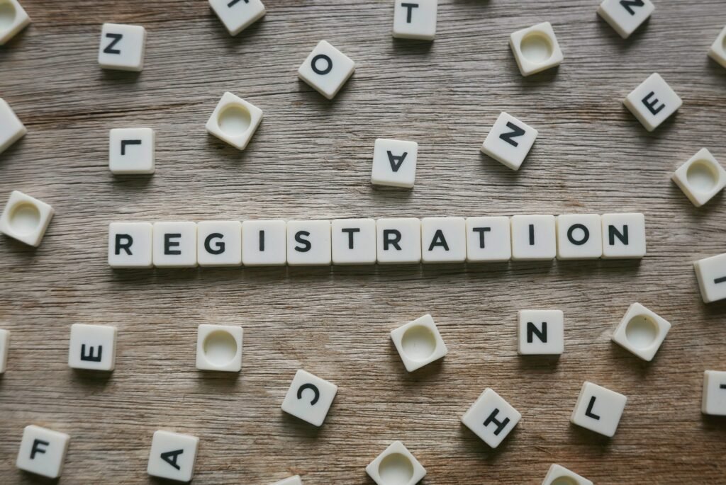 registration word made of square letter word on wooden background